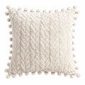 Cuscino decorativo 45 x 45 cm in tessuto sintetico avorio con trecce e pompon